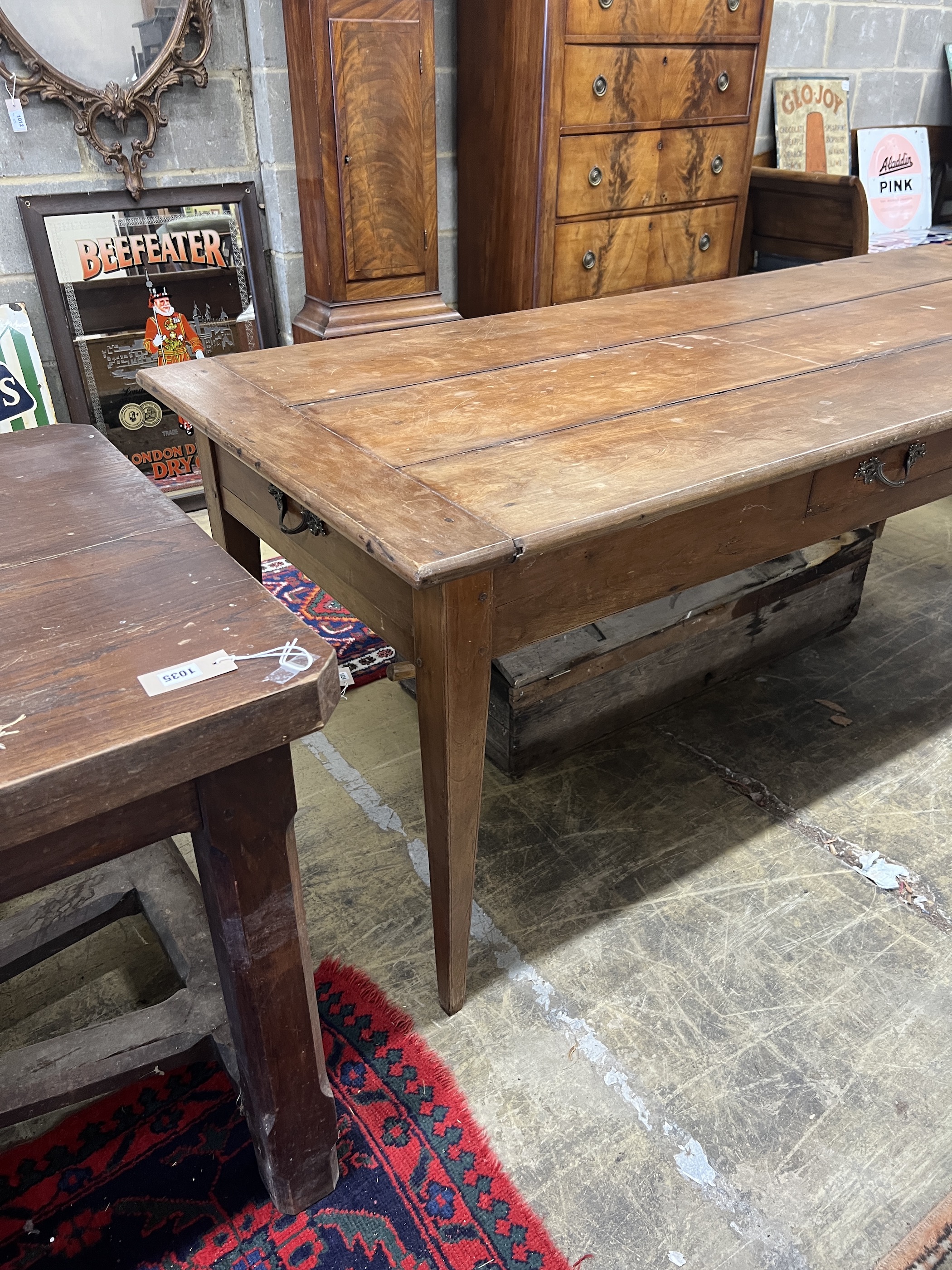 A 19th century French cherry three drawer kitchen table, length 200cm, width 81cm, height 76cm